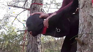 Tied up to a tree alfresco mainly sexy clothes, wearing pantyhose and high ankle boots heels, rough fuck